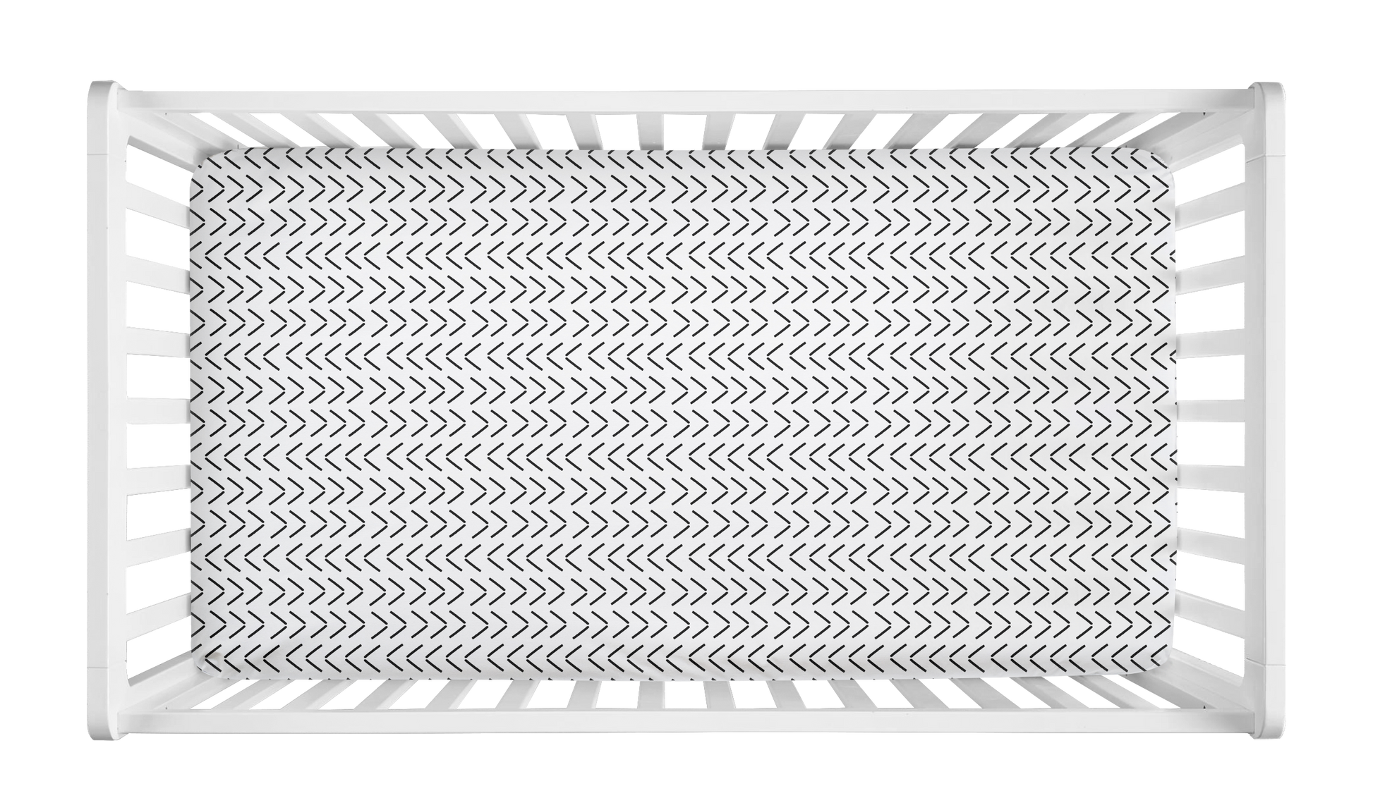 White crib sheet with black mudcloth-style arrow pattern in a modern white crib.
