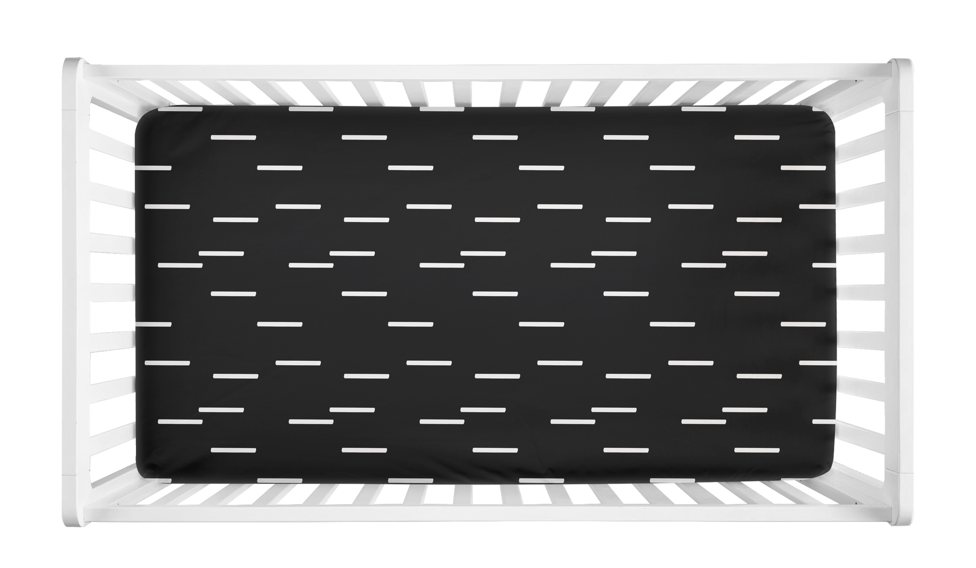 Black crib sheet with minimalist white mudcloth dash pattern shown in a modern white crib.