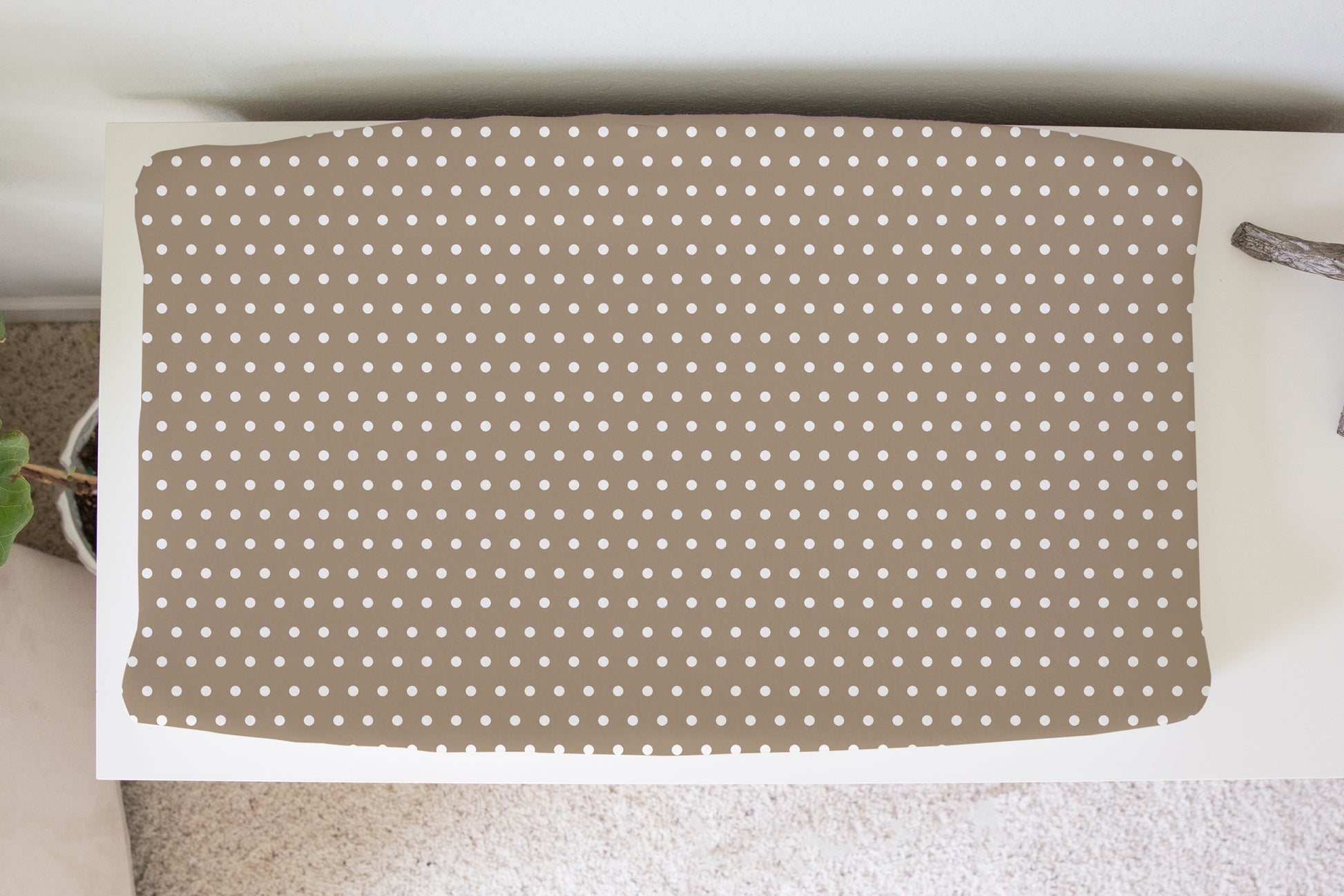 Beige polka dot changing pad cover for neutral nursery, soft gender-neutral baby bedding and modern nursery decor.