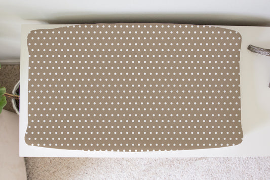Beige polka dot changing pad cover for neutral nursery, soft gender-neutral baby bedding and modern nursery decor.