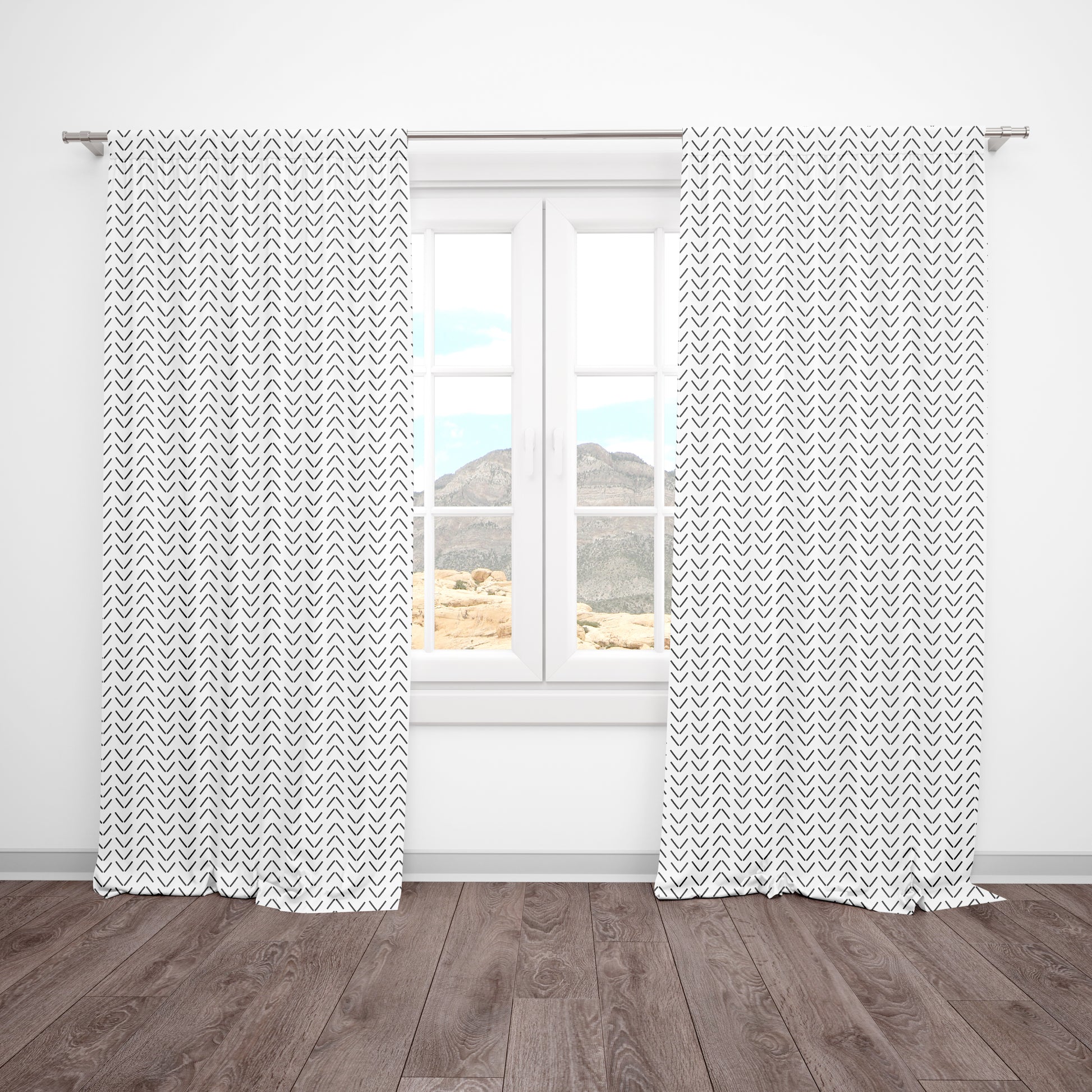 Neutral blackout curtains with black arrow print for a stylish modern nursery. Blocks sunlight and pairs with any neutral or boho theme.