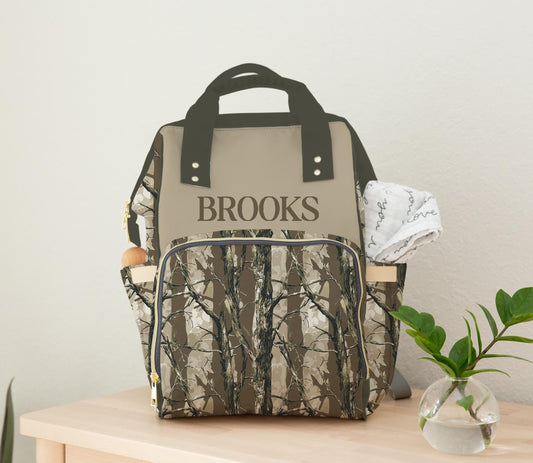 Personalized bottomland camo diaper bag backpack with tree bark hunting print and custom name