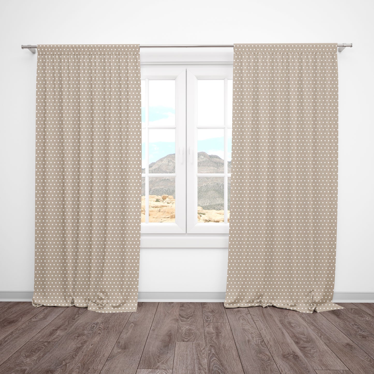 Beige and white polka dot curtains hanging in a neutral baby nursery or kids' room.