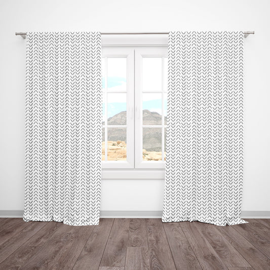 Neutral blackout curtains with black arrow print for a stylish modern nursery. Blocks sunlight and pairs with any neutral or boho theme.